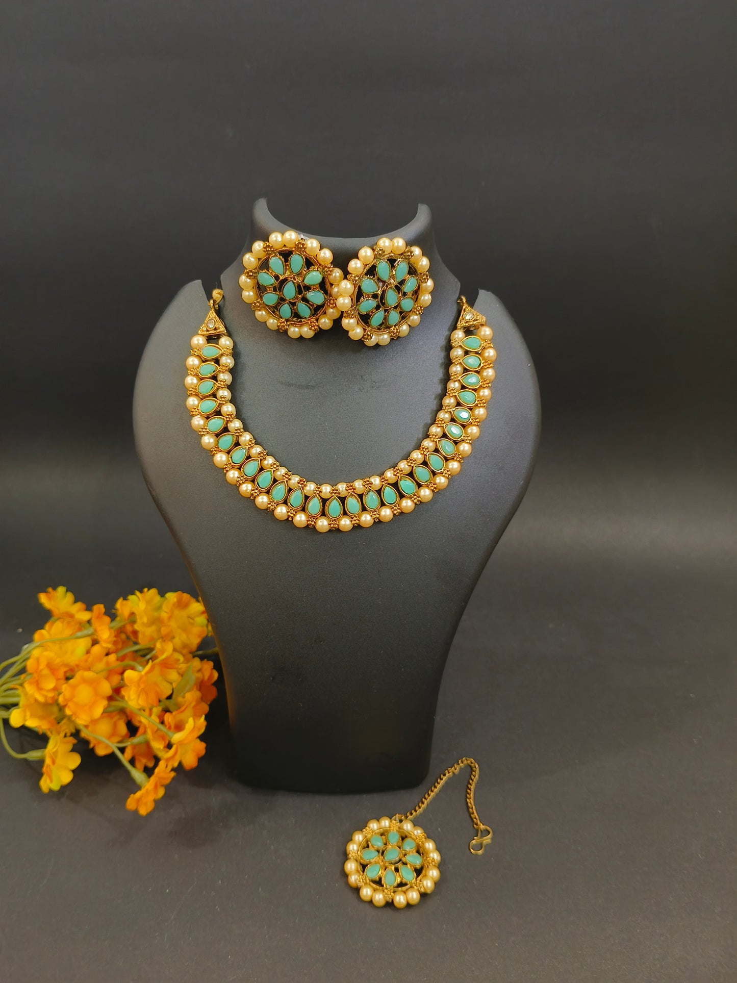 Sukkhi Ritzy Gold Plated Choker Necklace Set with Earrings & Maang Tikka