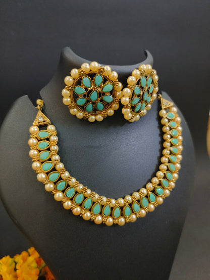 Sukkhi Ritzy Gold Plated Choker Necklace Set with Earrings & Maang Tikka